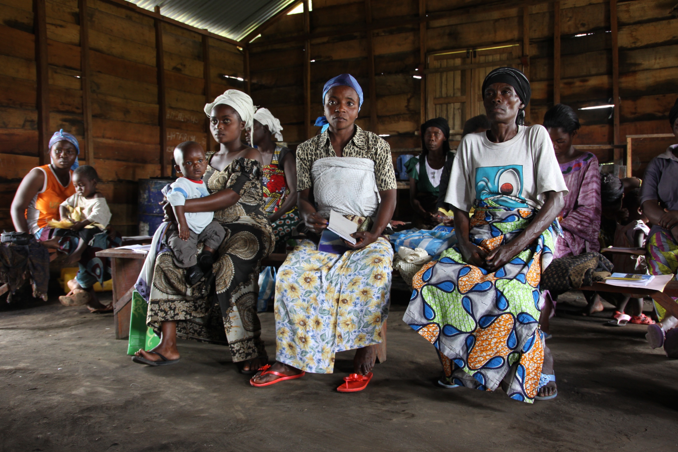 Today, in the IDP camp of Mugunga III outside of Goma, CARE staff member Rose leads a training against SGBV. The men and women have been chosen for their literacy and enthusiasm to take on social responsibility in the camps. (Photo: CARE/Sabine Wilke)