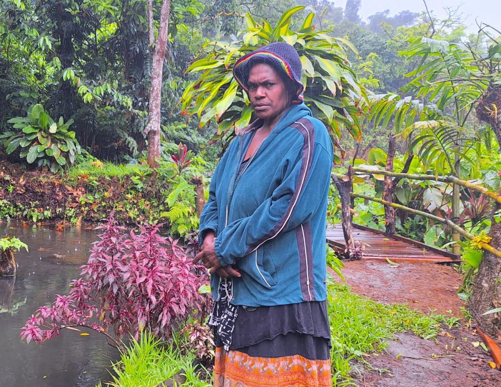 Caption-Grace-Nawata-standing-beside-one-of-her-fishponds-in-Loupikas-community-Central-Tanna-2048x1023 RESIZE