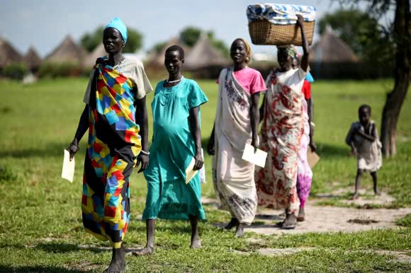 “My grandmother gave birth to my mother from her kitchen. She had just finished preparing the evening meal. She served my grandfather and his friends, walked in to the kitchen and delivered my mother. It was her seventh baby, in all there were ten children.” - Miabek. Photo: Josh Estey/CARE