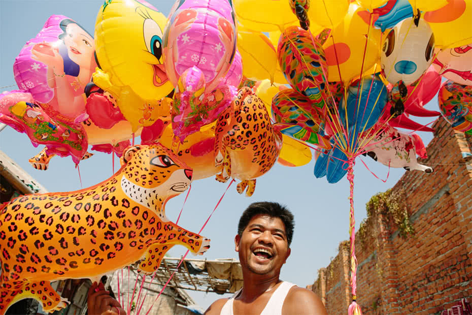 Aung Myit’s partner is living with HIV and they received a small business grant from CARE to help increase the family’s income. They used it to start a business selling balloons in Mandalay. ©Tom Greenwood/CARE