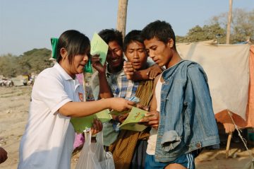 Condom distribution to dock workers in Mandalay, facilitated by CARE. ©Tom Greenwood/CARE.