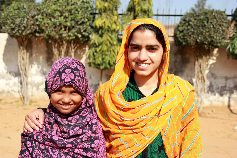 Indian schoolgirl Anusha with her teacher Saina.