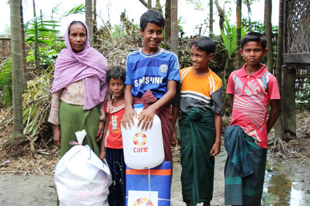 Widower and Myanmar floods survivor Kaw Tiza with her family.