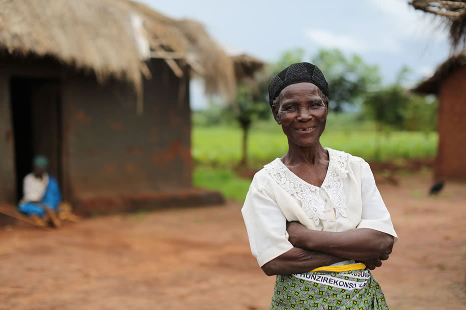 A woman stands proud with her arms crossed.