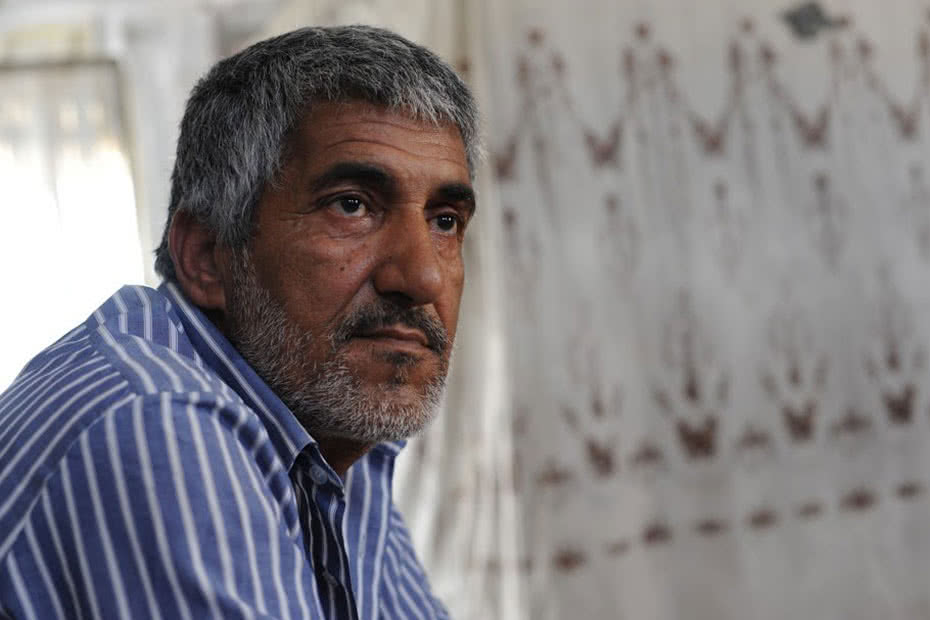 Syrian refugee Aeed used found materials to better insulate his family's temporary shelter in Azraq refugee camp.