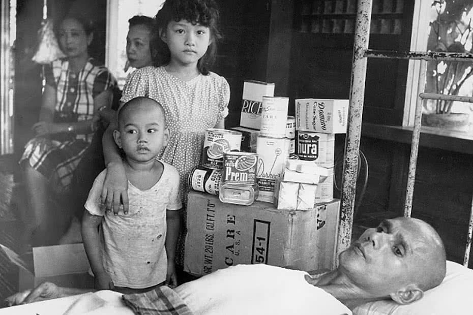 Historical photo of a Philippines family receiving CARE packages.