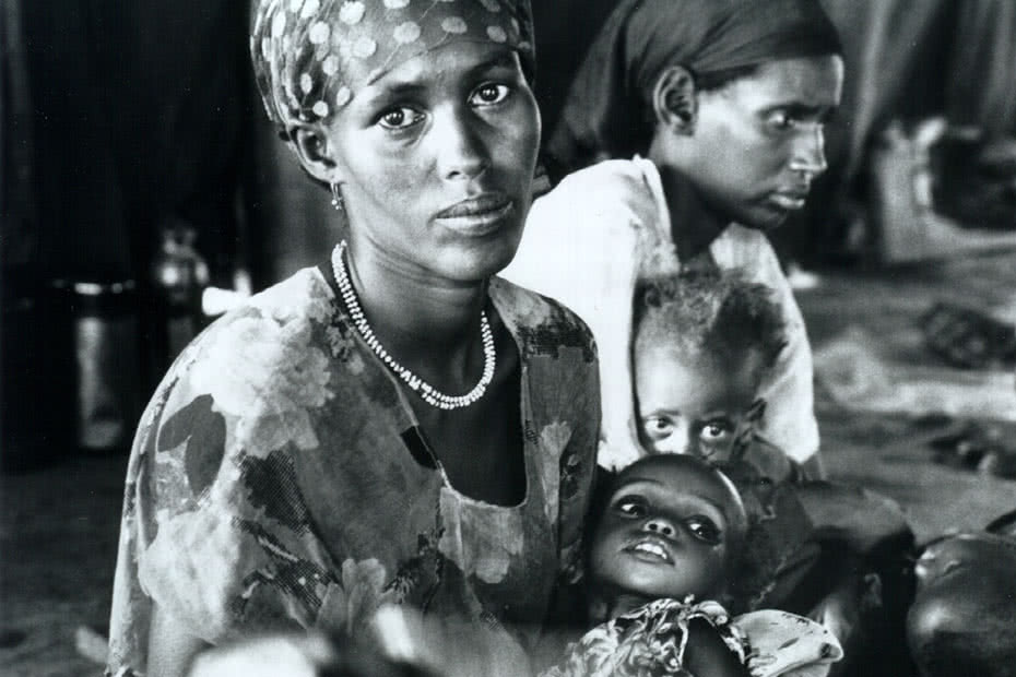 Historical image of Ethiopian mother and child assisted by CARE.