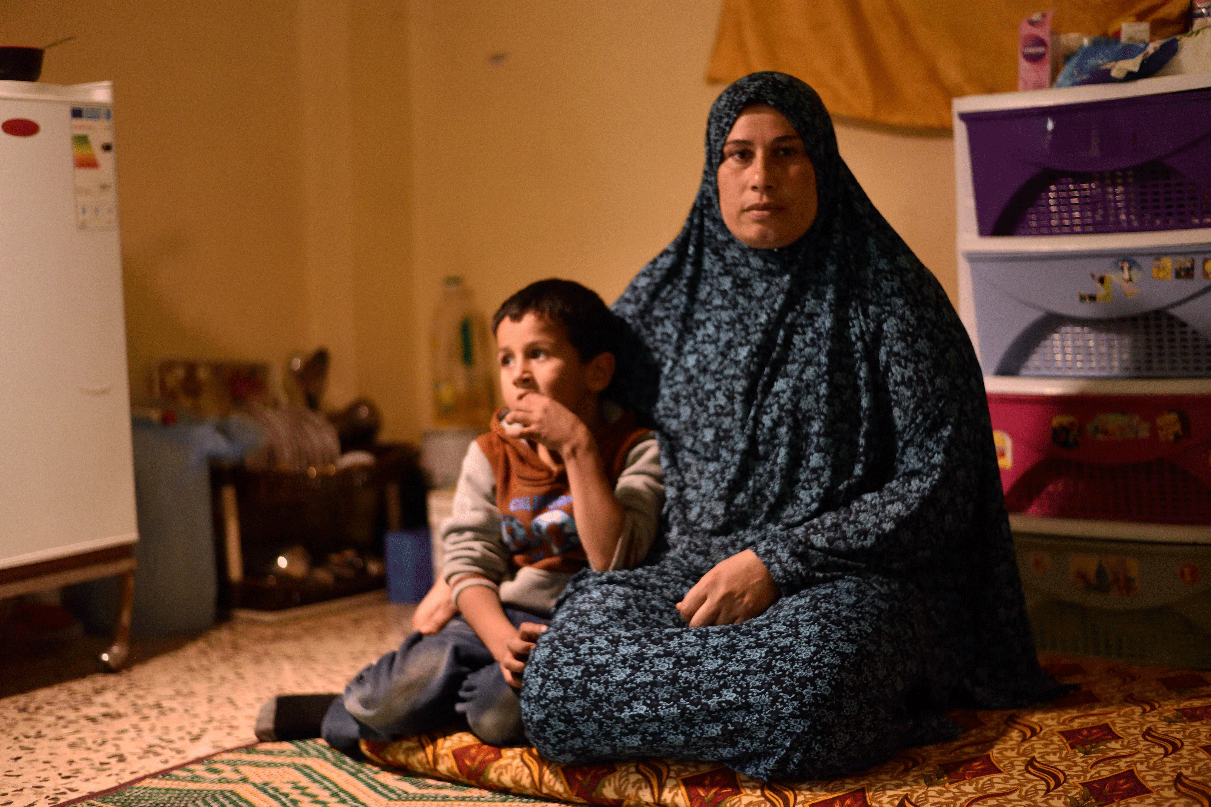 Single mother Sanaa lives in the one room with her eight children. They are refugees from Syria.