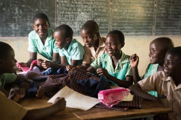 Classroom shots are of students learning how to sew reusable sanitary pads. Boys and girls learn about girls periods to reduce stigma and work together to help girls keep coming to school, even when menstruating.