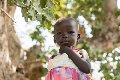 Feb Appeal_resize2 Two-year-old Paska in Torit, Eastern Equatoria, South Sudan. Her family received relief items from CARE including soap, tarpaulins, blankets, jerry cans, mats, and cloth. Their home was burnt to the ground by armed men who came to the town on 11 July 2016 and Paska lost three of her siblings who drowned trying to cross a nearby river. Their bodies washed up down river three days later.
Background: CARE has been operating in Southern Sudan since 1993, providing humanitarian relief to internally displaced people in Western Equatoria, Jonglei State and Upper Nile. South Sudan has the highest inflation rate in the world, at over 700%. The ongoing civil war has led to wide spread insecurity, hunger, and exploitation of women and girls. 1.6 million people are currently displaced and 5.1 million people are in need of aid. CARE is working in Health, Nutrition, Food and Security, Livelihoods, Peace Building and Gender. The images were taken in and around Mankien, Unity State, South Sudan during November 2016.