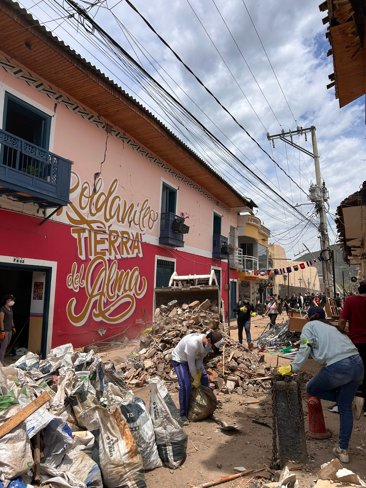 Community members unite in hard-hit towns to clear fallen masonry and navigate the long road to recovery. Photo © CARE/Lorena Bejarano